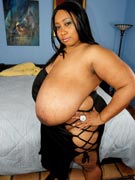 Biggest breasts black BBW Cotton Candi 46M brings super busty M-cup massive mammaries to BBWDreams.com