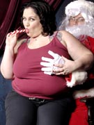 Glory Foxxx puts the XXX in XXXmas with a busty titfuck and Santa cum on her belly in Xmas sex Christmas porn pics at BBW Dreams - BBWDreams.com